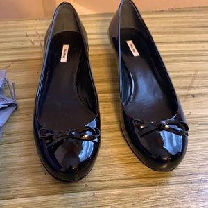 Black slid on short heel with bow, US size 6, torn bow, only tried on.